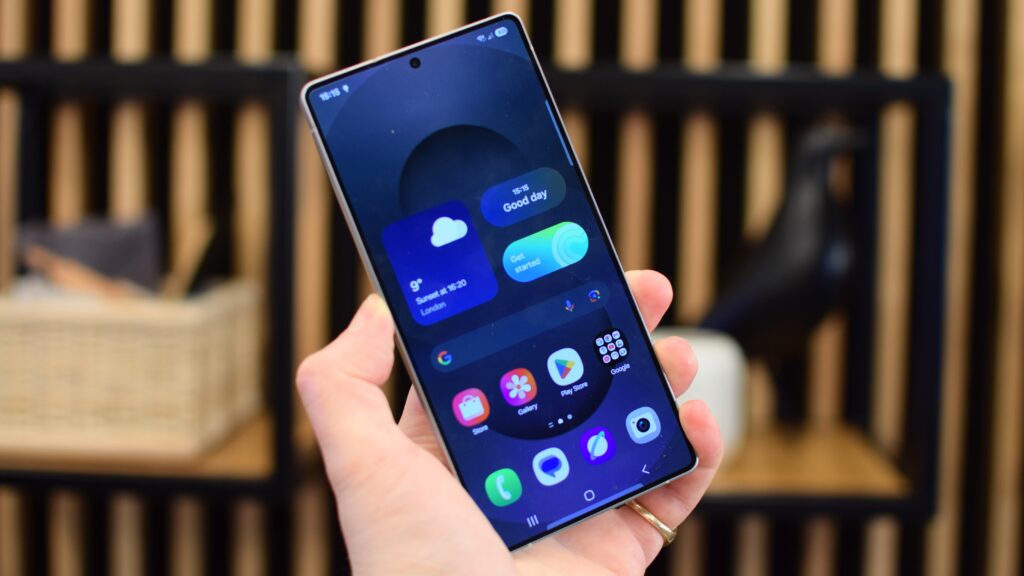 “User holding Galaxy phone showing Samsung Members app screen”